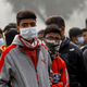 Young boys battle the smog.